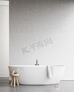 建筑摄影照片_带一把椅子和一条毛巾在白色的墙壁附近的浴缸