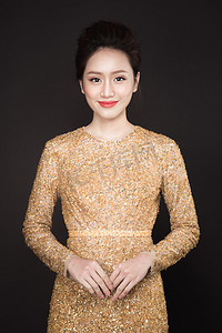 woman wearing golden dress