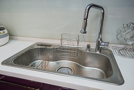 furniture摄影照片_Modern kitchen sink in a luxury apartment