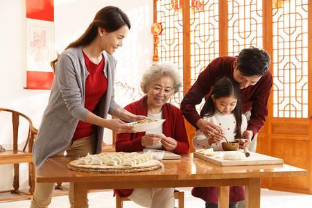 包饺子儿童摄影照片_幸福家庭过年包饺子