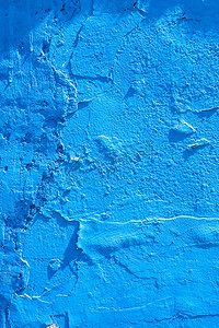 工笔风材质摄影照片_阳光下的蓝色抹灰水泥墙材质纹理贴图背景摄影图配图