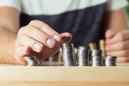 person stacking coins 