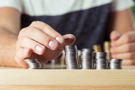 payment摄影照片_person stacking coins 