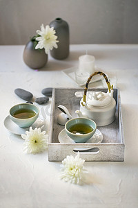 Afternoon Chinese green tea on white table top.
