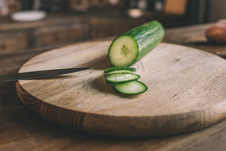 chopped cucumber on cutting board 