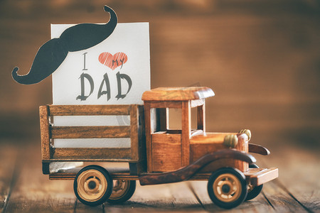 Happy father's day! Postcard on background of wooden table.