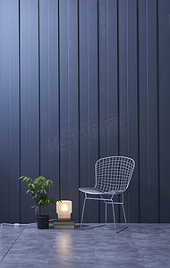 stylish摄影照片_Modern dark blue  wall, textured wall, blue decorative wall,  and green plant in interior concept. 