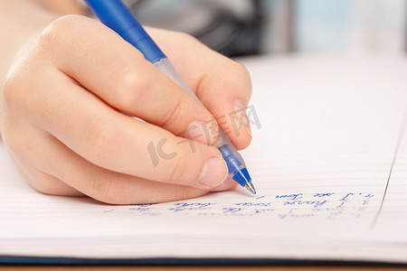 part摄影照片_Anonymous pupil hand writing homework