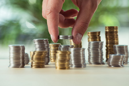 person stacking coins 