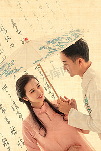 古典情人节摄影照片_打着油纸伞的复古青年伴侣