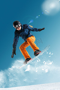 运动玩耍摄影照片_滑雪的青年男人