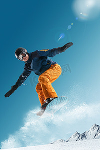 酷酷的装备摄影照片_滑雪的青年男人