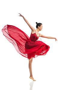美女腿摄影照片_穿红色裙子跳芭蕾舞的青年女人