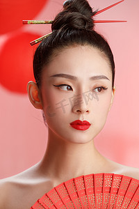 春节扇子扇子摄影照片_彩妆美女肖像