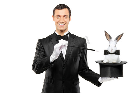 双节购机双惊喜摄影照片_魔术师控股帽子的兔子