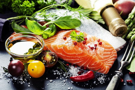 Delicious  portion of  fresh salmon fillet  with aromatic herbs,