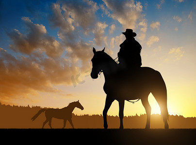 天猫活动logo摄影照片_剪影牛仔与马