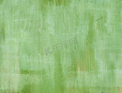 微妙摄影照片_画油画涂抹背景的微妙的绿色手绘画笔描边