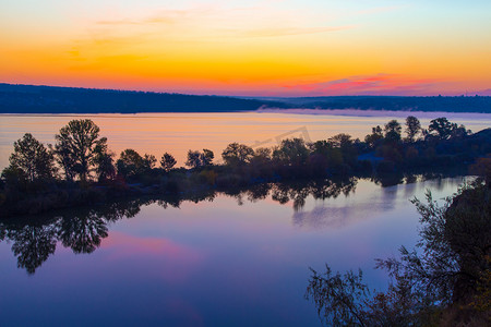 Amazing orange dawn on blue lake