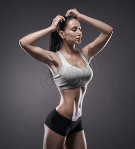 健身模型摄影照片_运动的年轻女子做健身锻炼