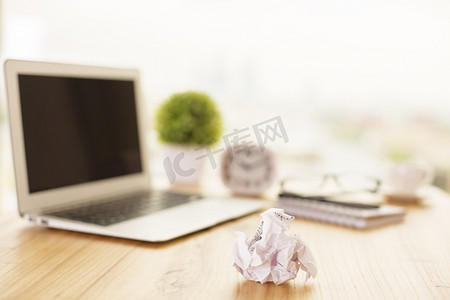 Crumpled paper on office desk