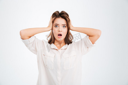 Woman covering ears and shouting