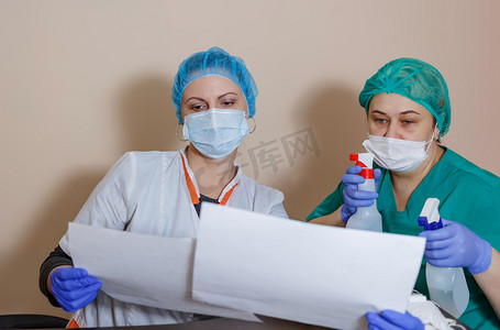 A female doctor in a sterile mask and uniform on a break after prevention during the covid-19 coronavirus pandemic