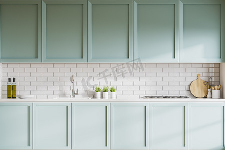 时尚厨房的内部，有白色的砖墙，蓝色的橱柜和台面，内置水槽和炊具。3d渲染