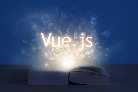 学习Vue.j.打开的书本里闪烁着光芒，上面写着许多字。教育概念。学习编程语言