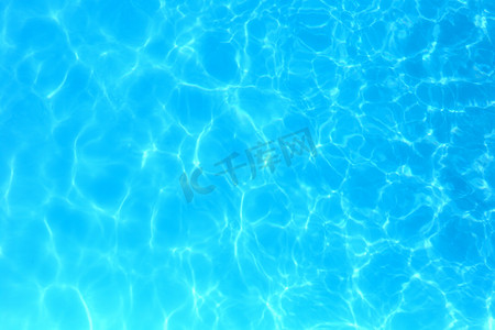 Blue color water in swimming pool rippled water detail backgroun