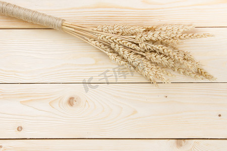Sheaf of Wheat over Wood Background. Harvest concept. Top view