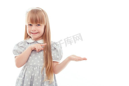 Surprised little girl pointing left