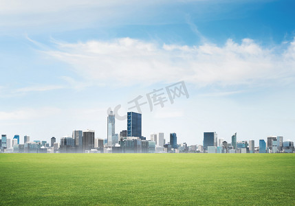  modern cityscape with green spring field 