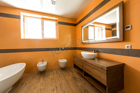 家具橙色摄影照片_现代浴室内的橙色和白色颜色 