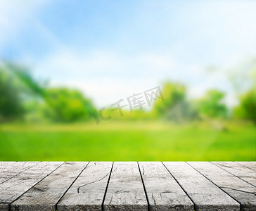 春天绿色海报摄影照片_木头桌子顶部背景和绿色的 3d 渲染