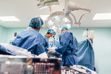 Team of Surgeons Operating.