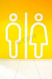 橙色背景上的男人和女人的象征