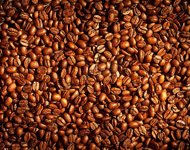 棕色咖啡豆背景摄影照片_芳香的炸咖啡豆背景