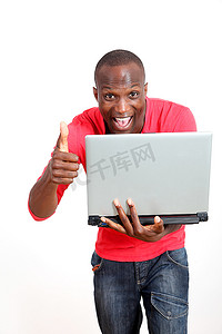 黑色背景宣传摄影照片_愉快的人与笔记本电脑在白色背景