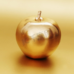 金色的苹果在金色的背景上香水金珍珠