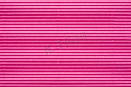 粉色纹理线条摄影照片_粉色纸板质地。抽象背景