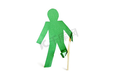 一个受伤的绿色手杖人物，白色背景上有一根拐杖