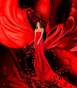 红心连红心摄影照片_爱情女神穿着红色长裙，留着华丽的长发，在红色的窗帘、布料上连接着人们的心，这是一个神奇的仪式