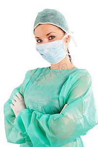 穿手术服的医生摄影照片_身穿绿色手术服的护士在镜头前看着白色