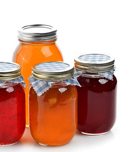 大桃子摄影照片_自制果酱、果酱和蜂蜜装在玻璃瓶里