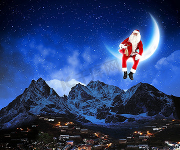 月球山脉摄影照片_圣诞老人坐在月球上的照片，下面是城市和山脉