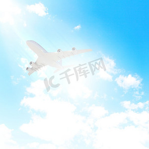 背景为云的飞机在空中飞行的图像