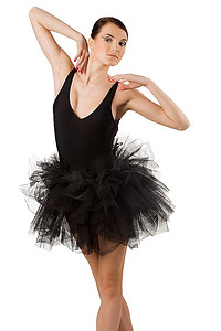 芭蕾鞋子摄影照片_穿着黑色连衣裙和鞋子的经典舞者在白色背景下摆芭蕾舞姿势