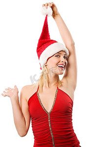 年轻的金发女子，穿着红色上衣，戴着一个小礼盒，戴着一顶圣诞帽