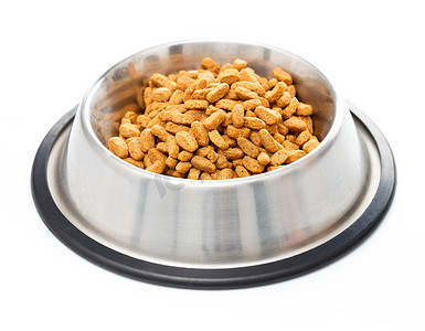Bowl full of pet food for cats